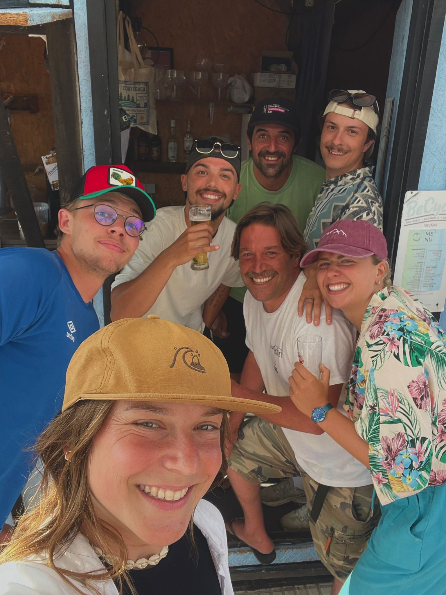 Surf school group socialising indoors — surf camp Portugal and Porto region community